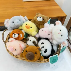Assorted cute mini animal plush toys collection including panda and rabbit in a wicker basket