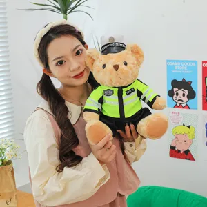 Traffic police teddy bear plush toy in neon green uniform held by a model in a lifestyle setting