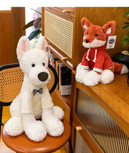 Detailed view of cute plush fox and dog toys in cozy outfits on a wooden shelf.