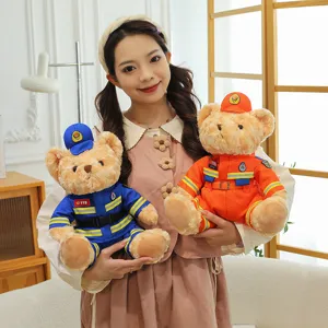 Soft plush teddy bear doll in firefighter and rescue uniforms held by a female model