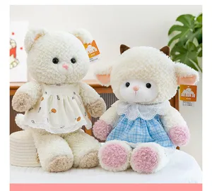 Close-up of adorable bear and lamb plush dolls wearing cute dresses in a home setting