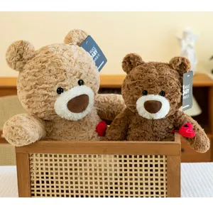 Close-up of two adorable teddy bear plush dolls sitting in a rustic wooden woven basket