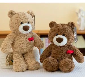 Macro detail of two plush teddy bears in light and dark brown soft rose-textured fur