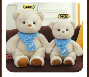 Comparación de dos ositos de peluche blancos con bufandas azules en tamaños 40cm y 55cm