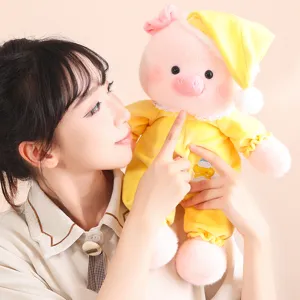 Soft and cute pink plush pig doll wearing yellow pajamas and a sleeping cap gift