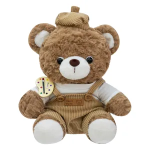 Soft brown artist teddy bear plush toy wearing a tan beret and corduroy overalls