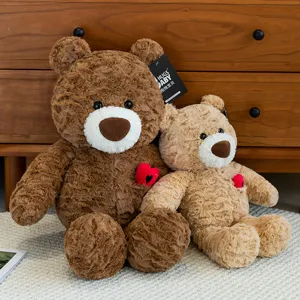 Two adorable rose swirl fur teddy bear plush toys with red hearts displayed on a white rug