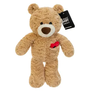 Adorable light brown teddy bear plush toy featuring rose-swirl fur and a red heart.