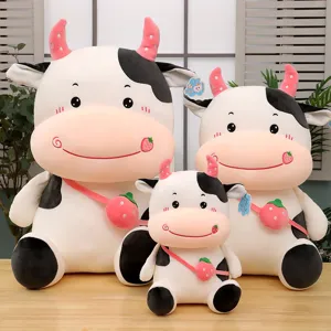 Three cute plush cow dolls in different sizes featuring strawberry bags as gifts