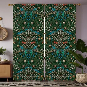 Vintage floral and bird pattern curtains in a classic dark green botanical room setting