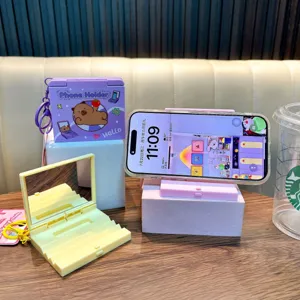 Creative multifunctional folding mirror keychain with integrated phone stand for bags