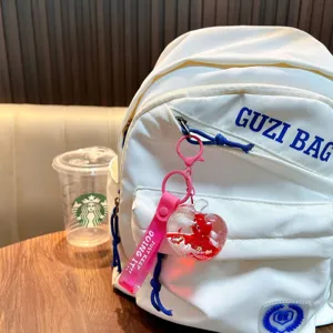 Süßer roter Apfel Flüssigkeitsschüttler Schlüsselanhänger mit rosa Band für die Tasche
