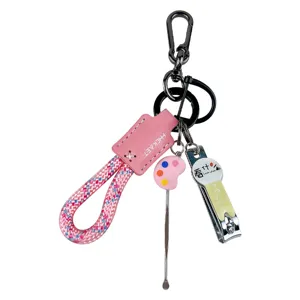 Creative pink braided rope keychain set including mini nail clipper and ear pick tools