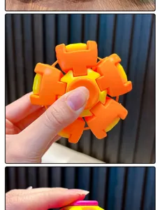 Detailed macro shot of an orange and yellow 3D mechanical fidget spinner toy