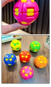 Close-up of colorful 3D gear puzzle balls for stress relief on a wooden table.