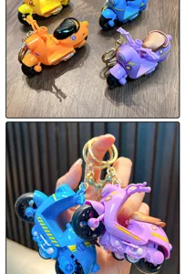 Close-up of colorful mini inertia motorcycle keychains in vibrant blue and purple colors