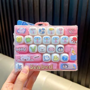 Kawaii pink 26-key mechanical keyboard fidget toy keychain with cute sea animal graphics