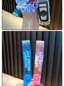 Detail view of blue and pink glitter straps with 'JUST KEEP DOING IT!' slogan