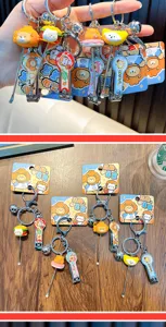 Detail view of cute cartoon animal food themed nail clipper and ear pick multi-tool keychains.