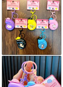 Colorful snail-shaped music keychains with cute cartoon animal patterns and hat details