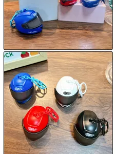 Detailed close-up showing mini glowing helmet keychains in blue, red, white and black colors.