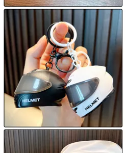 Close-up of creative black and white mini motorcycle helmet keychains