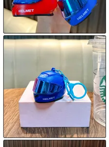 Detailed view of miniature motorcycle helmet keychain in blue, featuring visor and keyring.