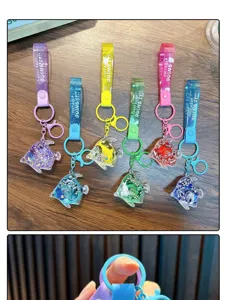 Set of six colorful fish-shaped liquid quicksand keychains with matching PVC straps