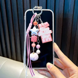Porte-clés mignon en forme de barre de chocolat avec pompon rose et pendentifs étoiles