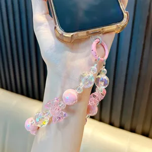 Handmade crystal beaded phone charm with iridescent bow and pink round beads strap