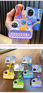Detailed view of astronaut mini piano keychains in various vibrant colors and designs