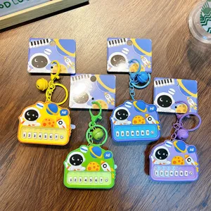 Astronaut-themed mini toy piano keychains in vibrant colors for backpack charms
