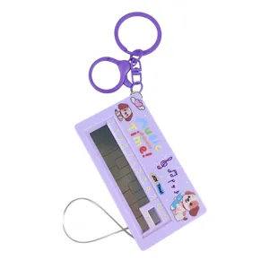Handheld electronic piano keychain with cute dog design and purple finish