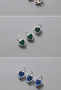 Primo piano di ciondoli a cuore in argento sterling S925 con cristalli verdi e blu brillanti