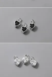 Dettaglio di ciondoli a cuore in argento S925 con zirconi neri e chiari