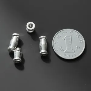 Detail view of S925 sterling silver screw clasps with coin for size comparison