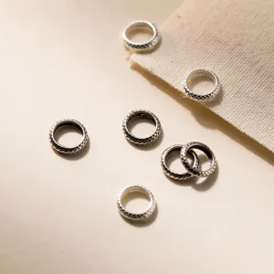 Macro detail of S925 vintage silver 8mm wheel spacer beads for DIY jewelry making