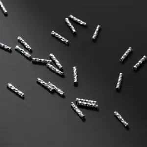 Macro shot of 925 sterling silver diamond cut tube spacer beads for DIY jewelry