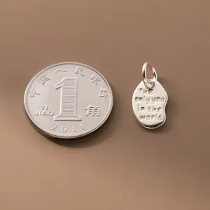 Ciondolo irregolare in argento S925 vintage con incisione The only you in the world.