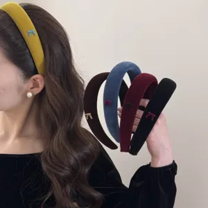 Detailed view of velvet sponge headbands with cute bow detailing in various colors