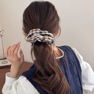 Vintage preppy checkered scrunchie hair tie with elegant white ribbon bow accents