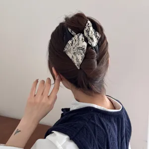 Elegant French vintage banana hair clip featuring monochrome ink wash floral bow