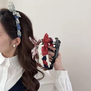 Detailed view of sweet rabbit ear headbands with various patterns and bow accents