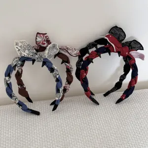 Detail of fabric-wrapped headbands with decorative bunny ears and bow knots