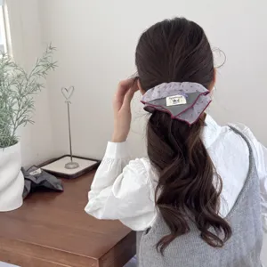 Close-up of a vintage cotton-filled hair scrunchie worn in a Mori girl style ponytail.