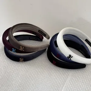 Premium velvet wide headbands with embroidered bow detail in multiple chic colors