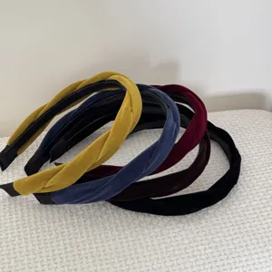 Close-up of elegant twisted velvet headbands in assorted vintage colors and soft texture