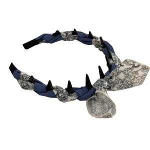 Elegant vintage floral twisted headband featuring unique black spikes and side bow ornament