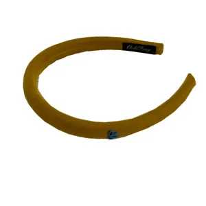 Vintage mustard yellow velvet headband with blue logo charm for elegant hair styling