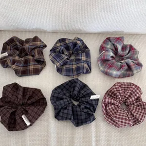 Set of six dark plaid vintage scrunchies in various colors for elegant hair styling.
